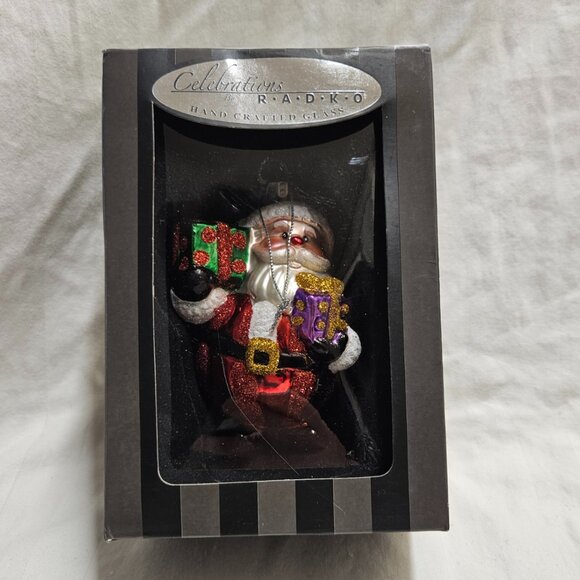 Celebrations By RADKO Glass Santa Holding Gifts Christmas Ornament 2015 - Picture 1 of 11